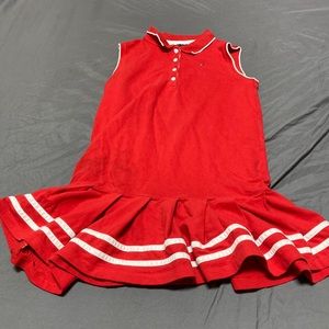 A Tommy Hilfiger red and white dress it’s a size 14 kids